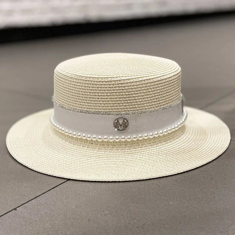 Straw hat with ribbon and pearl