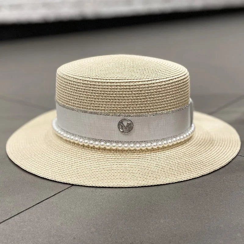 Straw hat with ribbon and pearl