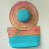 Straw hat and light blue beach bag