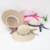 Straw hat with bow tie