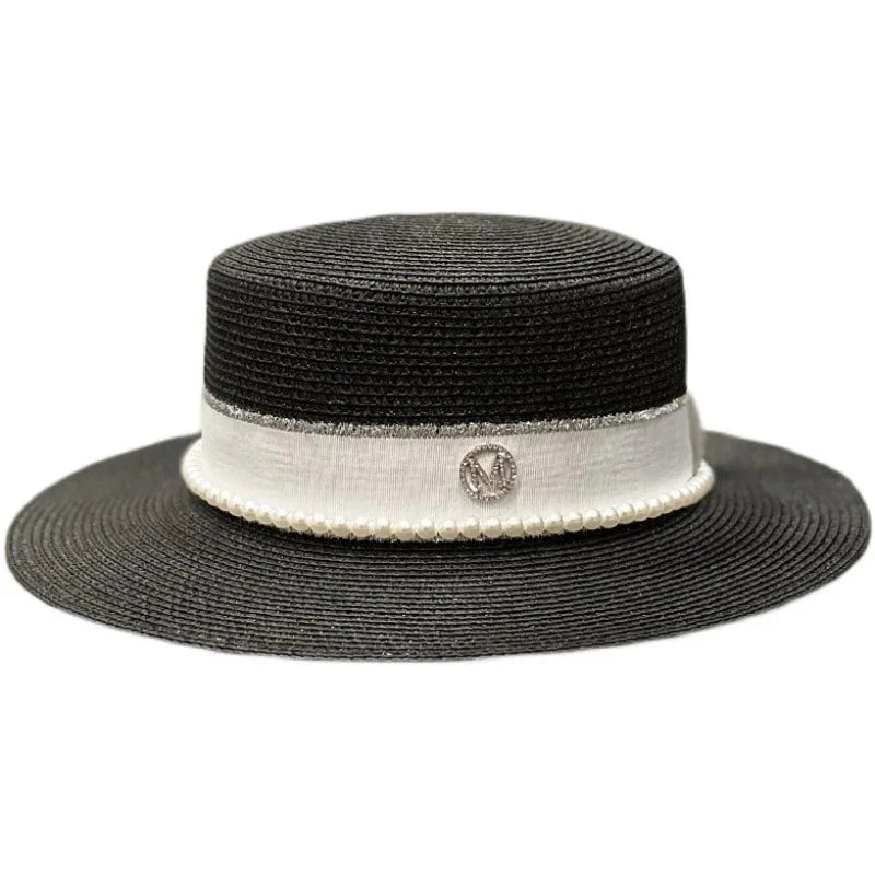 Straw hat with ribbon and pearl