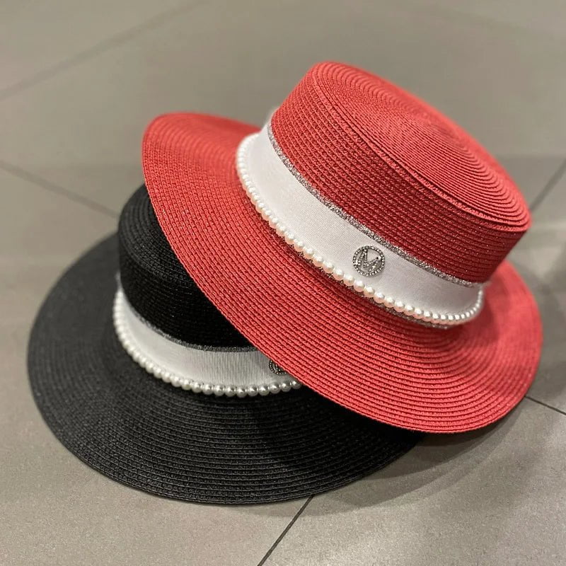 Straw hat with ribbon and pearl