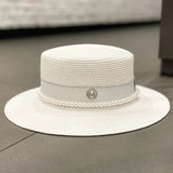 Straw hat with ribbon and pearl