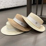 Straw hat with ribbon and pearl