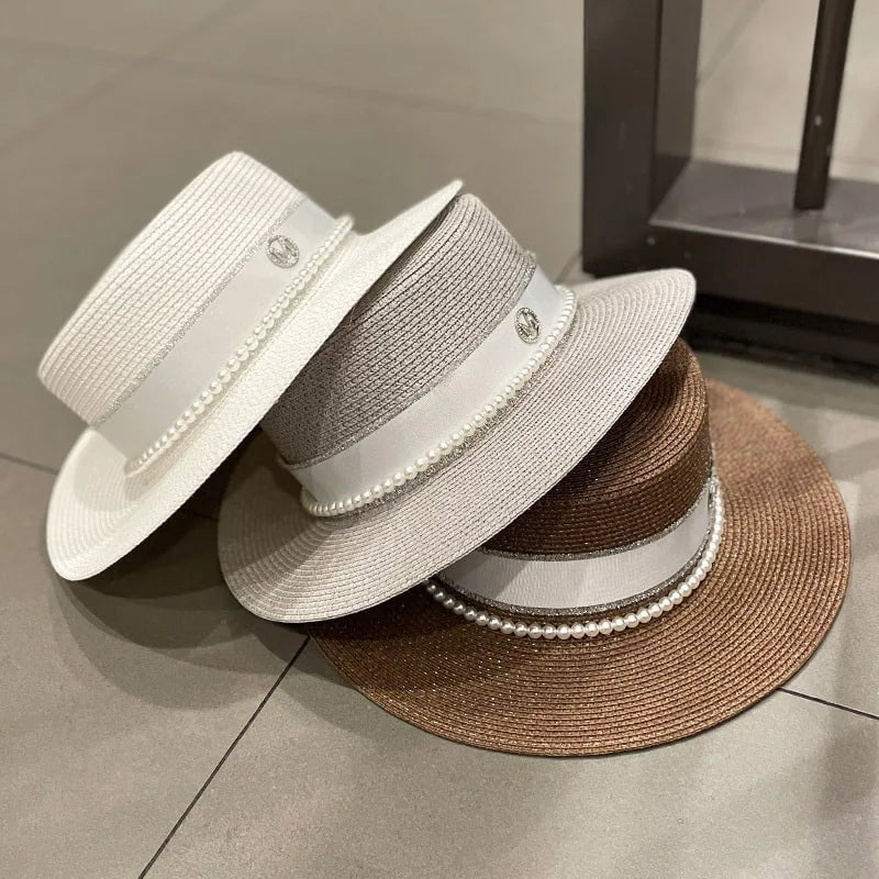 Straw hat with ribbon and pearl