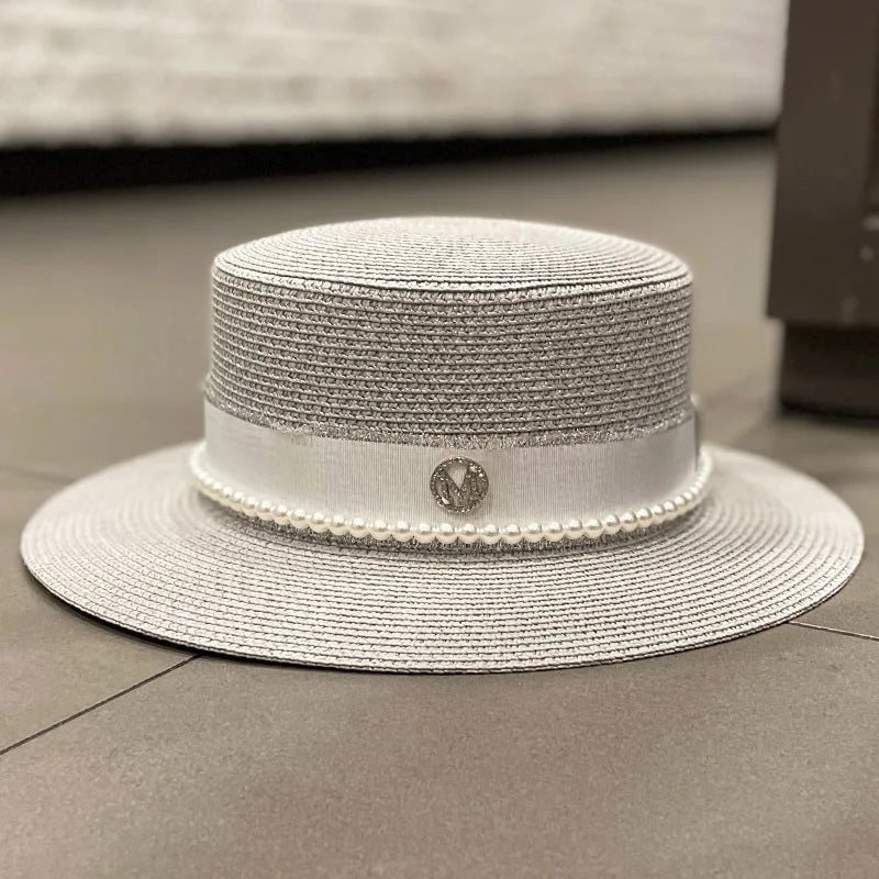 Straw hat with ribbon and pearl