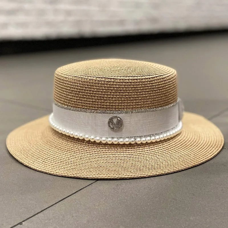Straw hat with ribbon and pearl
