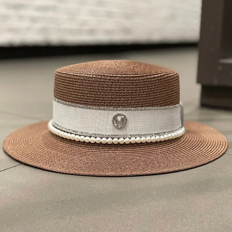 Straw hat with ribbon and pearl