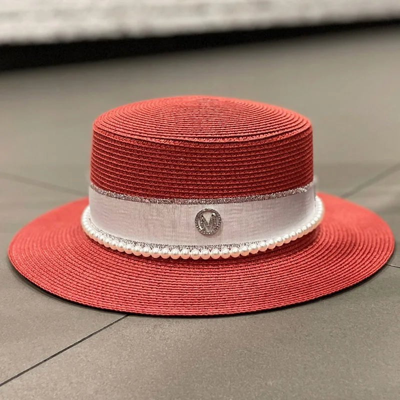 Straw hat with ribbon and pearl