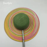 Straw hat and purple beach bag